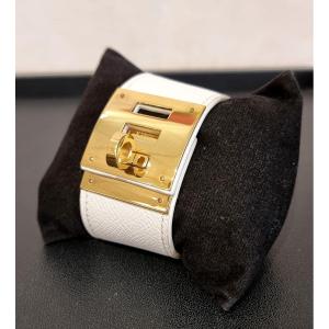 Hermès Bracelet Manchette kelly Dog en Métal Plaqué Or et cuir Epson Blanc