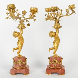 Pair Of Louis XVI Style Candelabra With Putto Carrying Flowered Vase. Circa 1890