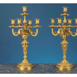Paire de candelabres en bronze doré 