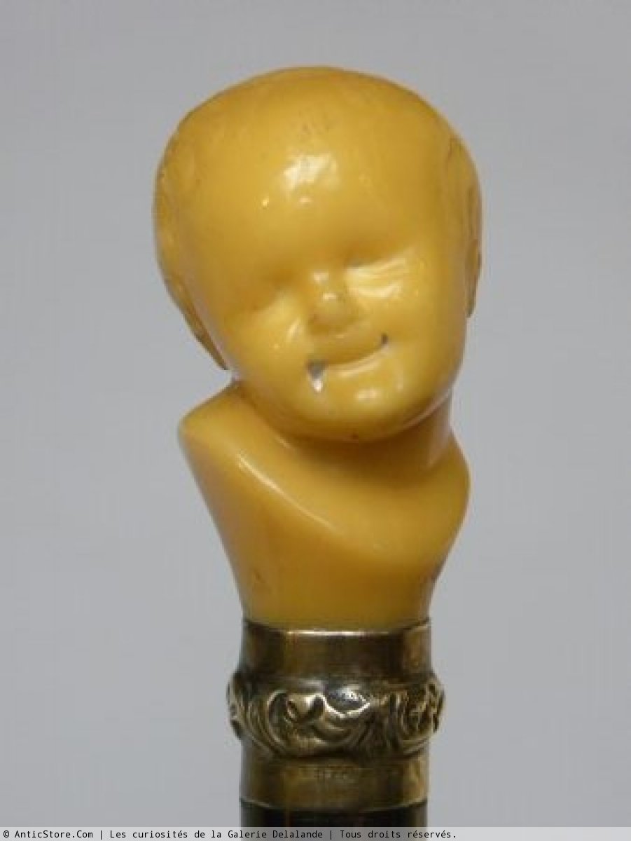 Collection Cane Representating A Child's Head Leaning