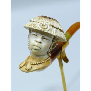 Pipe en écume de mer représentant un homme d'Afrique de l'Ouest avec sa coiffe traditionnelle