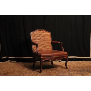 Fauteuil à la reine de style Régence canné en hêtre, XIXe siècle