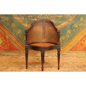 Fauteuil de bureau canné dit 'Couillard' en merisier laqué noir, époque Louis XVI