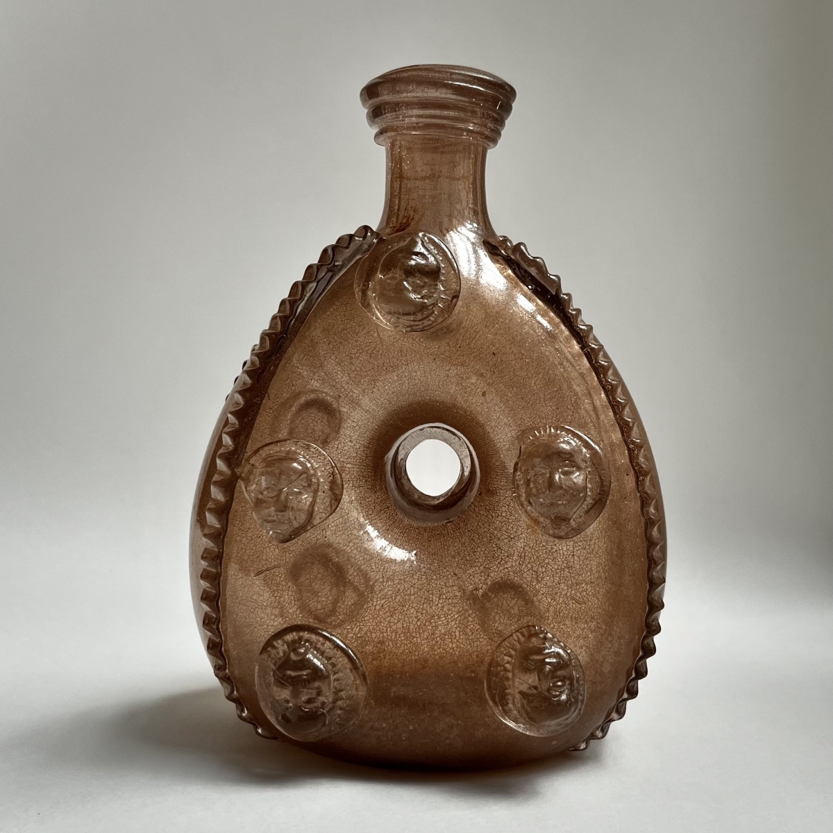 La Margeride - Blown-glass Ring-shaped Flask Decorated With Mascarons, 18th Century