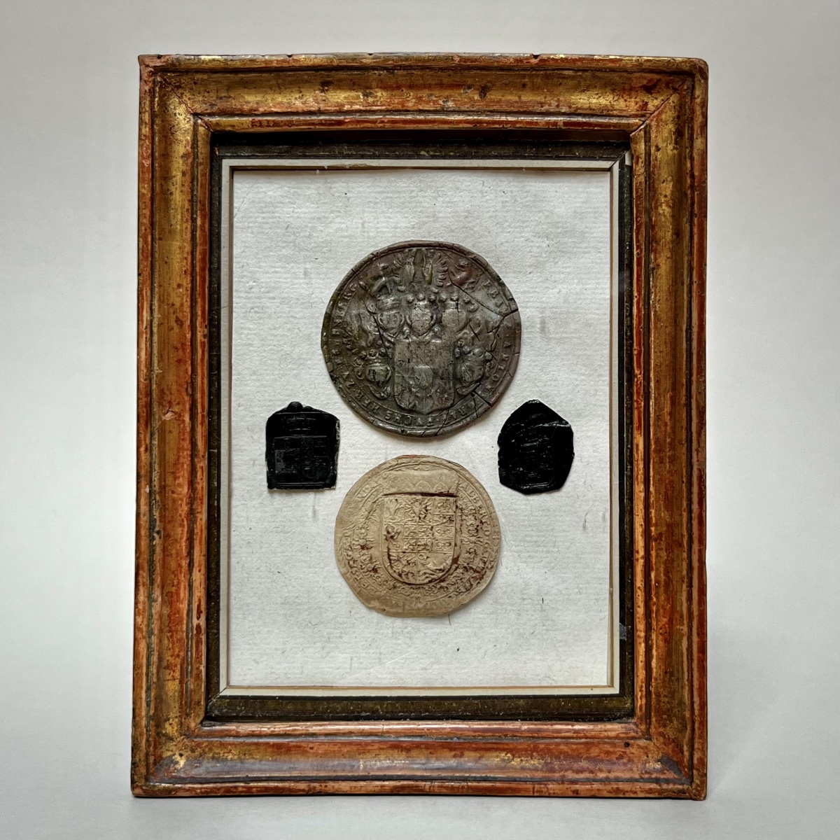 18th- And 19th-century Wax Seals In A Small Antique Gilded Wooden Frame From The 18th And 19th Centuries