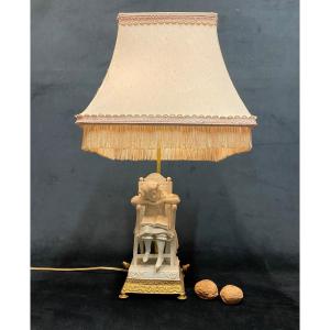 Lampe en biscuit monture bronze 