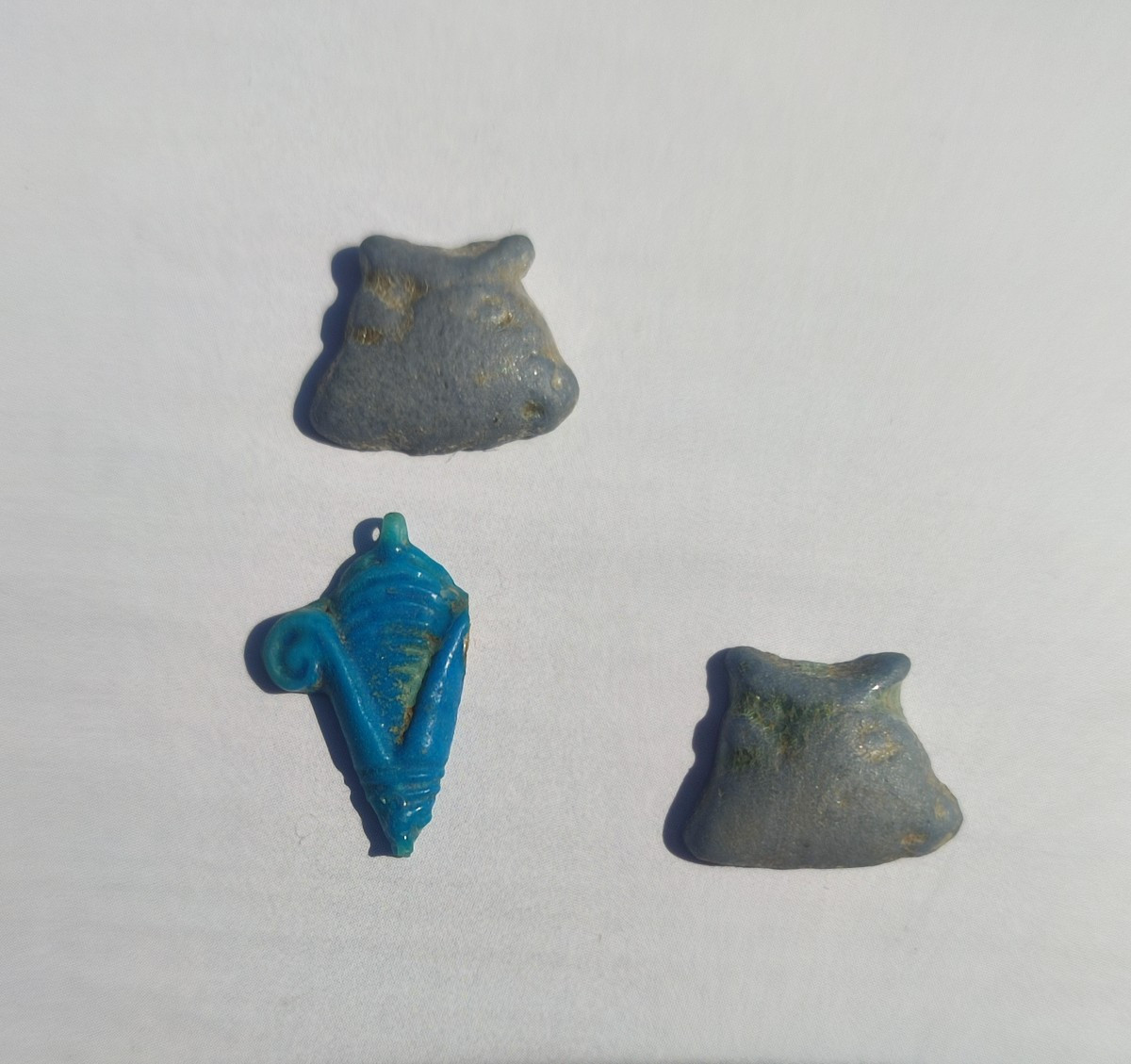 Two Bovine Heads And An Ear Of Corn. Late Egyptian Period.