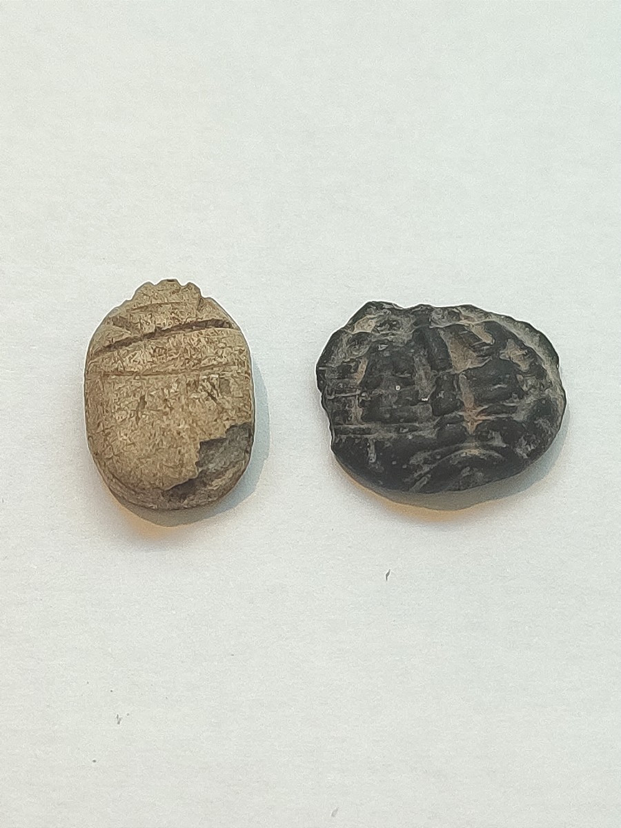 An Inscribed Scarab And An Amulet. Late Period Egypt 