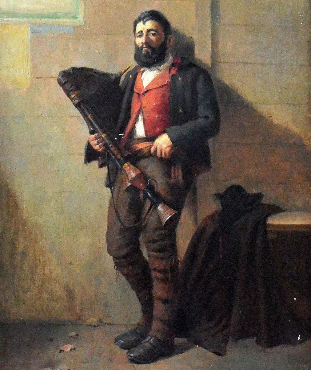 Le musicien ambulant à la cornemuse.-photo-2