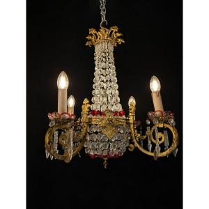 Lustre à quatre bras en bronze doré et cristal taillé, décor en verre rouge, début XXe siècle