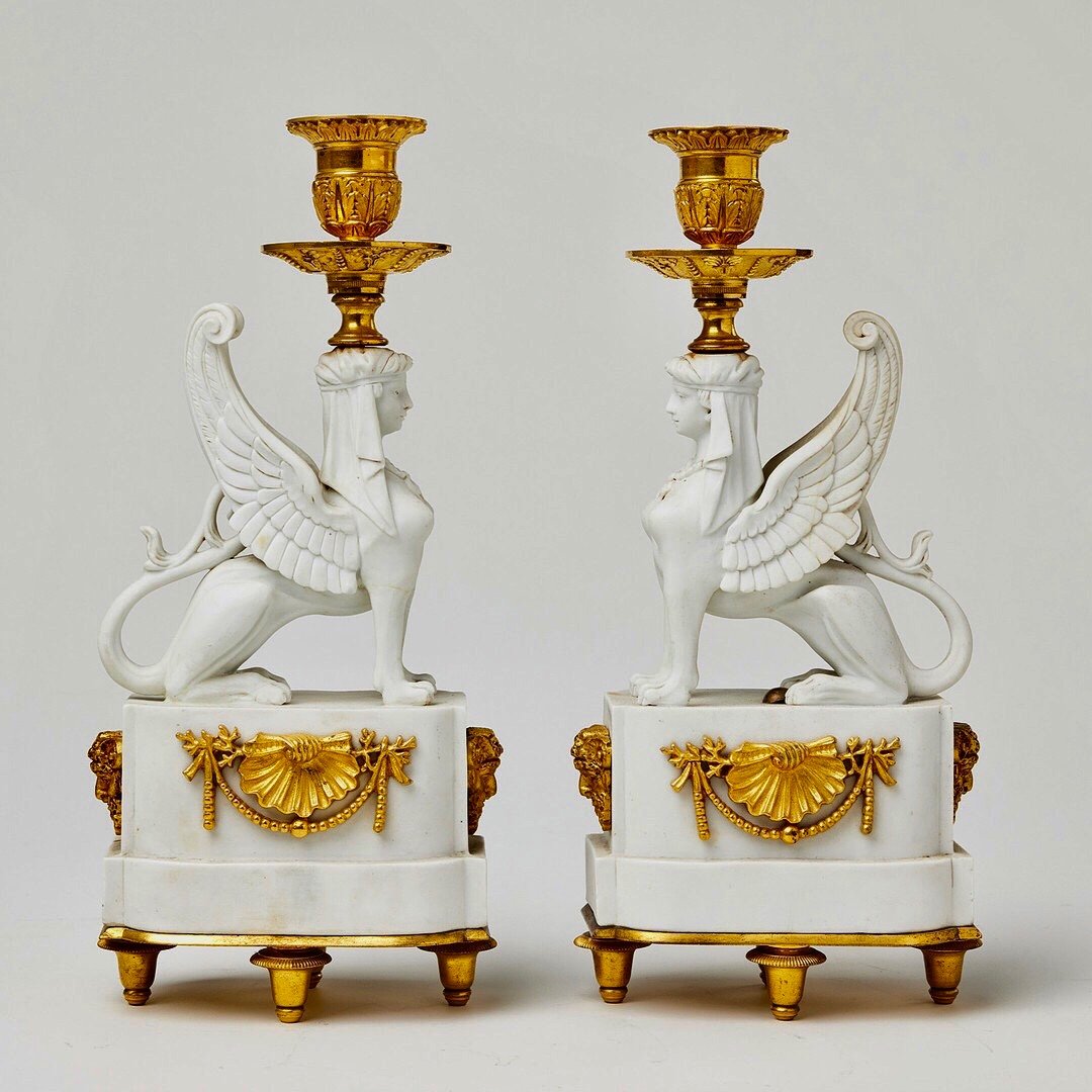 A Pair Of Bicuit  And Gilt Bronze Sphynxes Candelsticks , Variant Of A Model Attr To Nast 