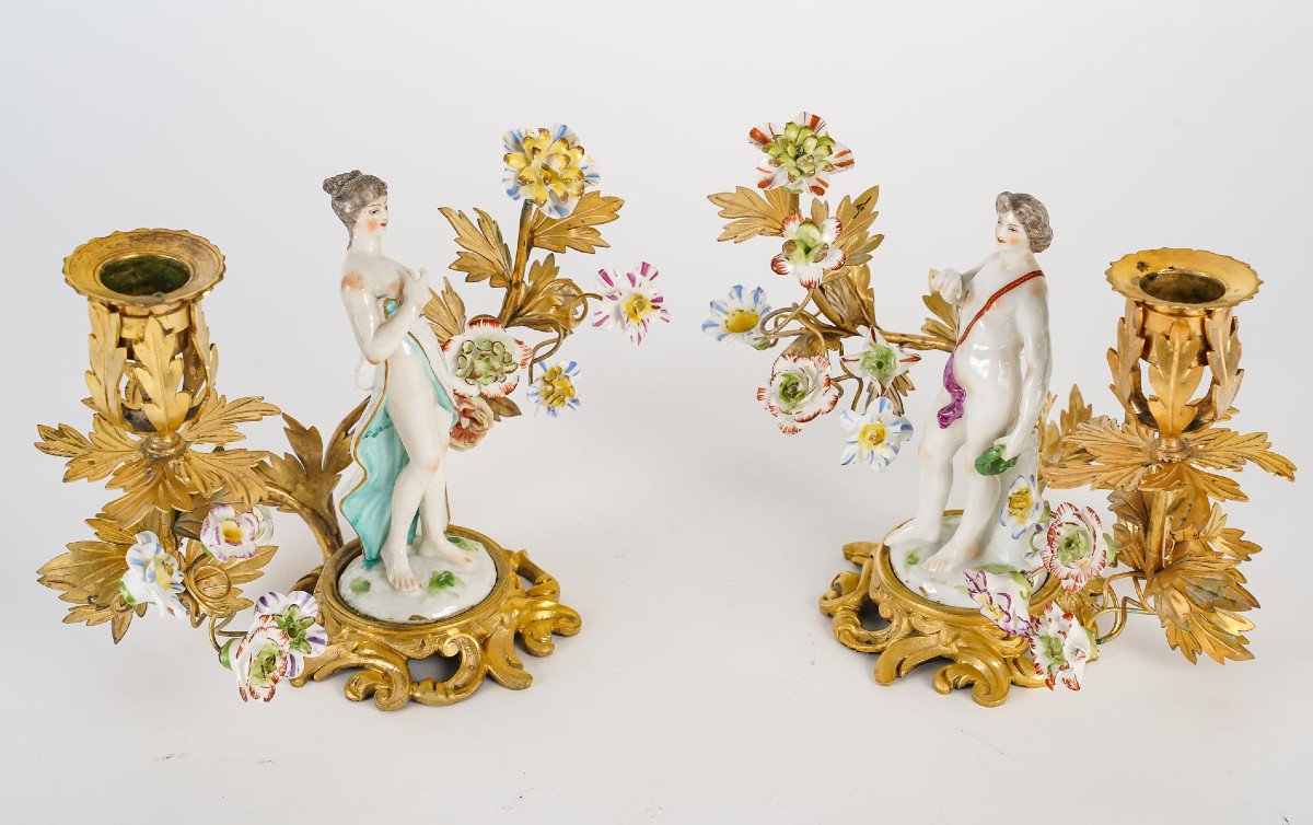 A Pair Of Lxv Style Candlesticks In Gilt Bronze, Flowers And Porcelain Figures