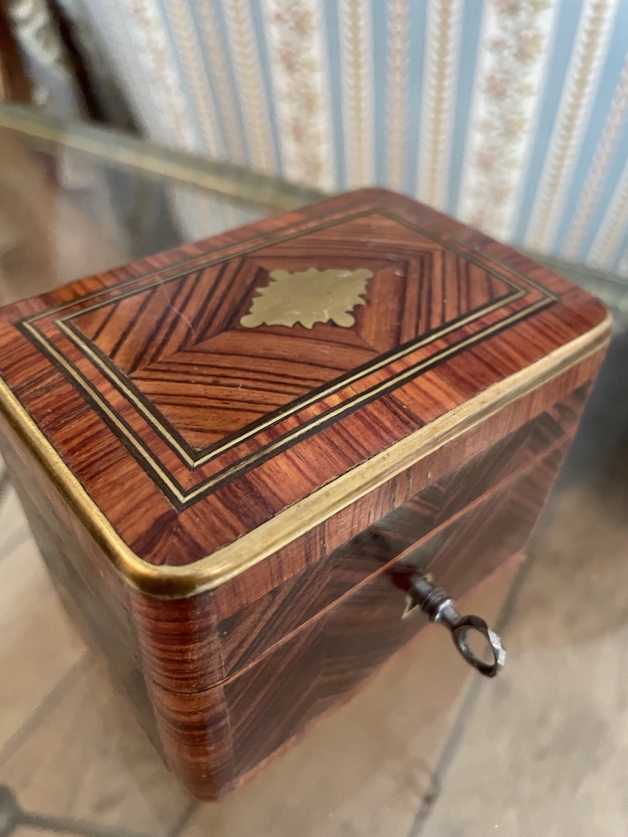 A Tiny Piggy Bank With Its Key