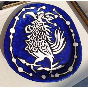 Jean Lurçat (1888-1966), Plat à décor de coq en céramique bleue et noire