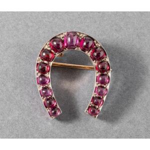 Old French Horseshoe Brooch In Gold And Garnets