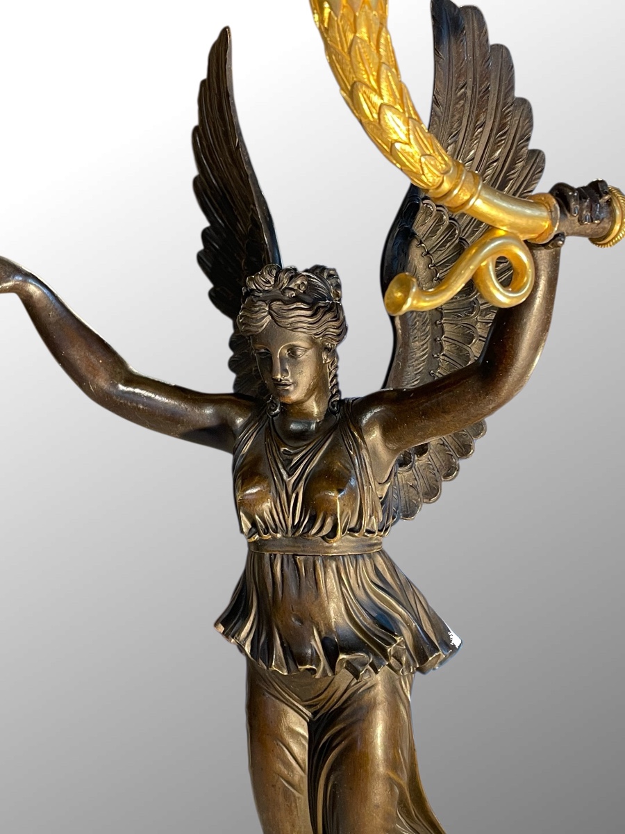 Candélabre en bronze patiné et doré. Epoque premier Empire.-photo-1