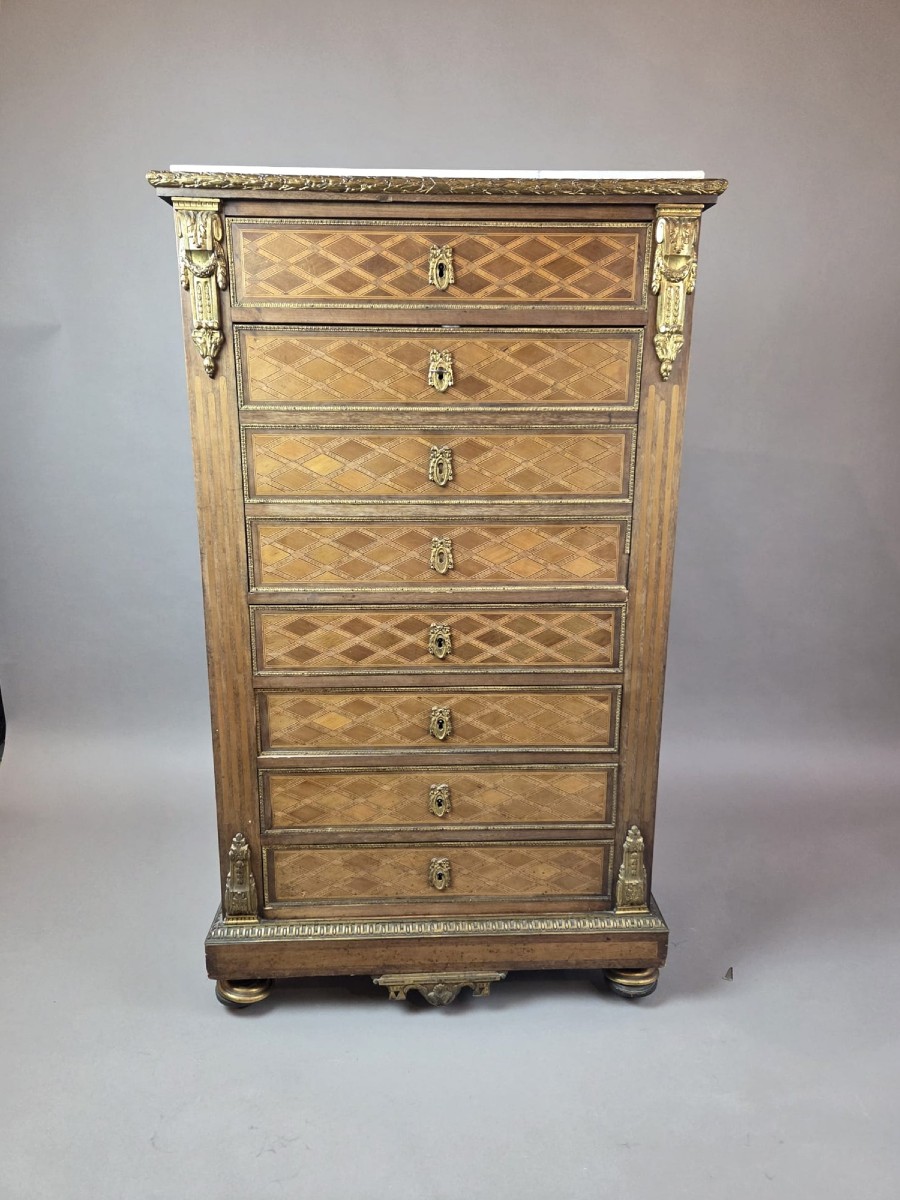 Secrétaire de style Louis XVI en bois marqueté et bronze doré