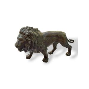 Sculpture "Lion qui marche" - Régule XIXe siècle style Barye - Longueur 23 cm