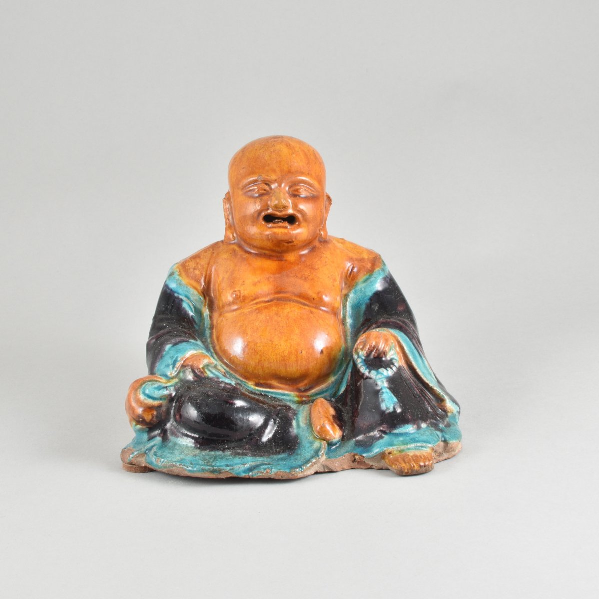A Chinese Figure Of Budaï Decorated With Polychrome Enamels. Ming Dynasty