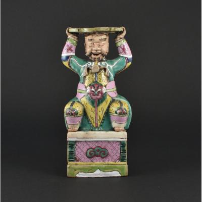 A Chinese Export Famille Rose Figural Candlestick. Late Qianlong / Jiaqing