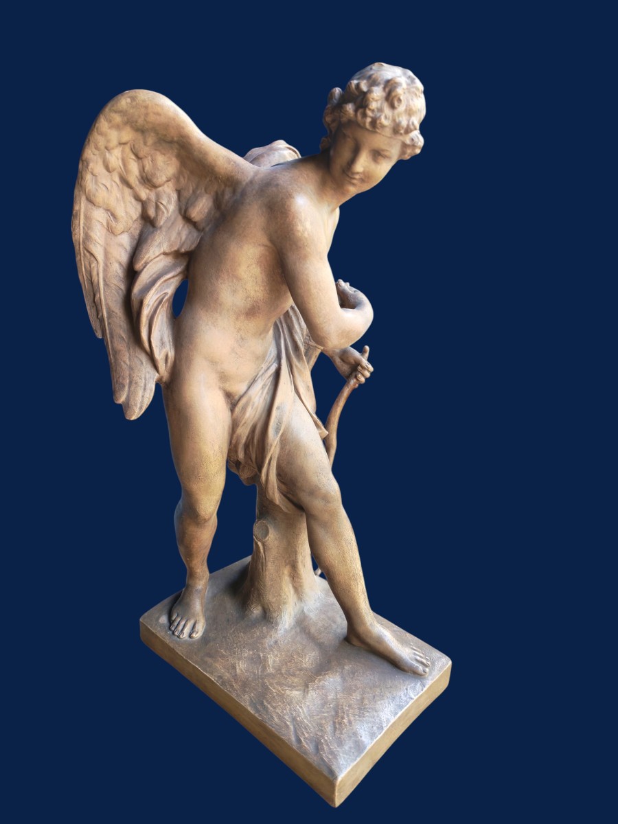 Sculpture en terre cuite, patiné brune représentant Cupidon XIXeme