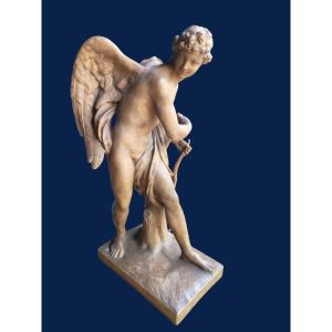 Sculpture en terre cuite, patiné brune représentant Cupidon XIXeme