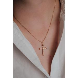 Croix en or jaune 750/000 à motif de ruban noué