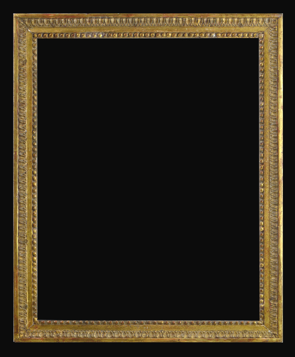 Cadre en bois sculpté d'époque Louis XVI.