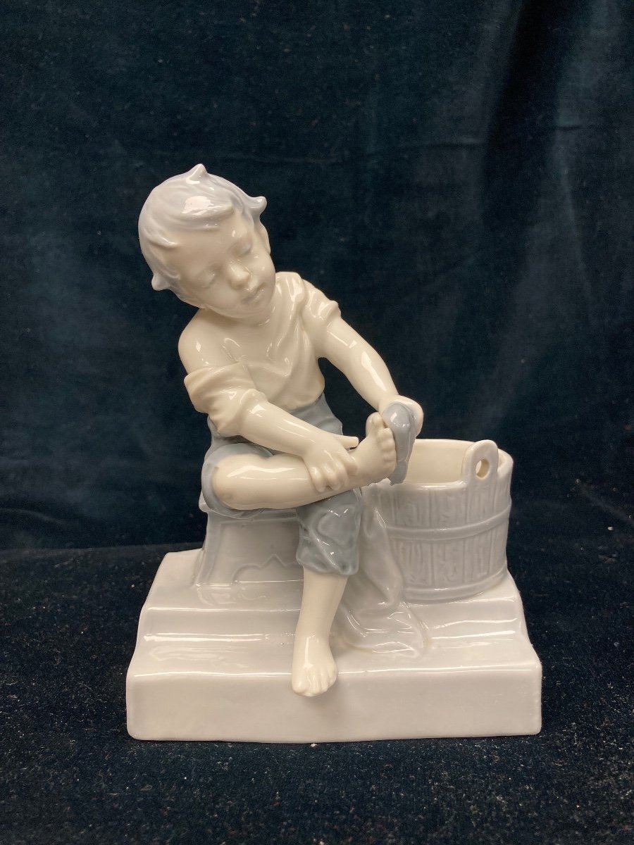 Porcelain Boy Figurine Washing His Feet