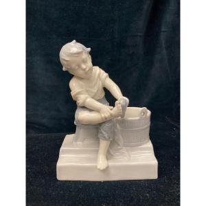 Porcelain Boy Figurine Washing His Feet