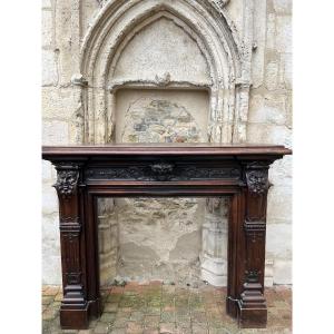 Importante cheminée en noyer vers 1890