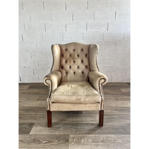 Fauteuil à oreilles en cuir capitonné – vers 1880