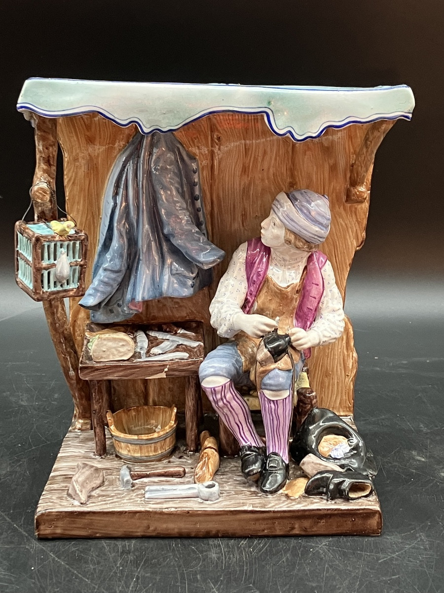 Saint Clément , le sabotier groupe en faïence polychrome