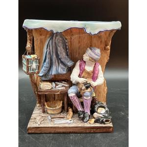 Saint Clément , le sabotier groupe en faïence polychrome