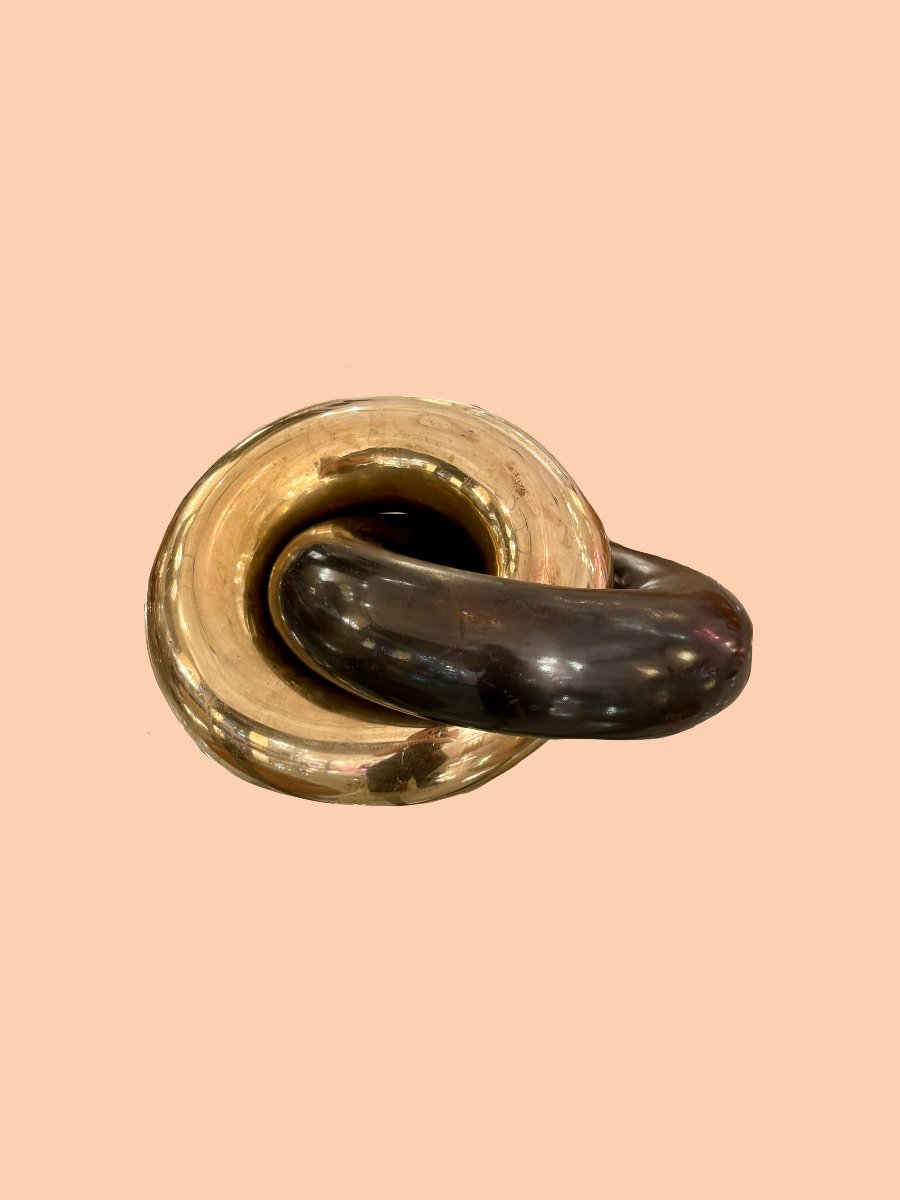 Table Sculpture Featuring Two Intertwined Rings