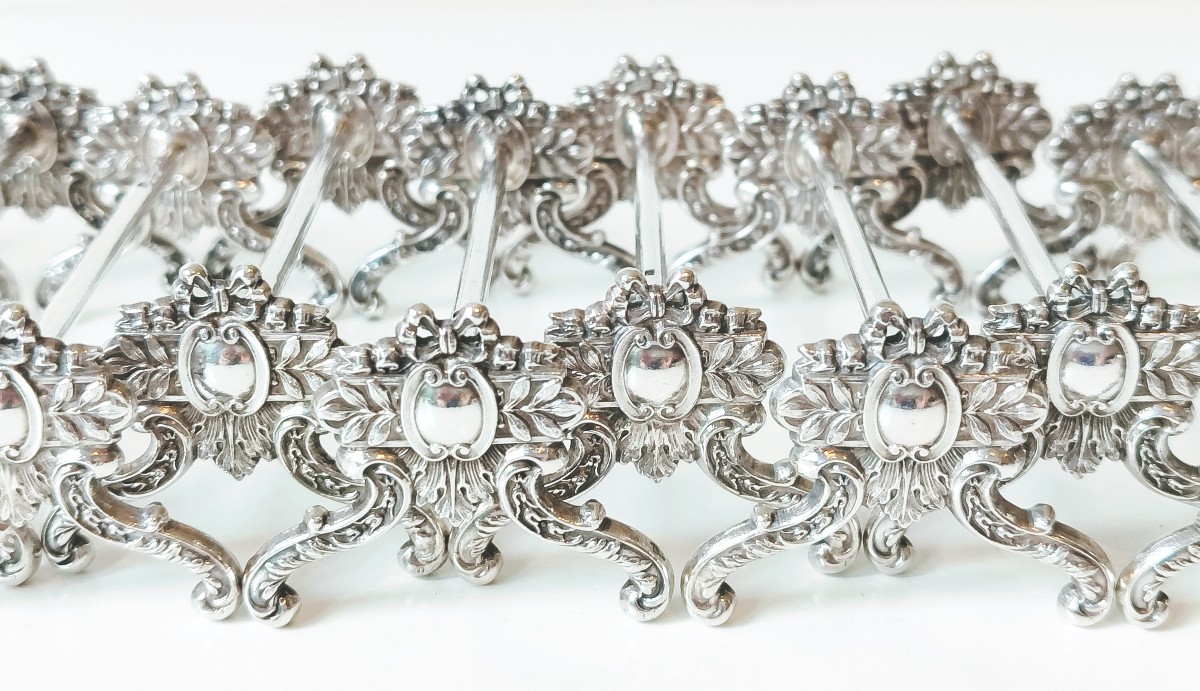 Twelve Solid Silver Knife Holders 