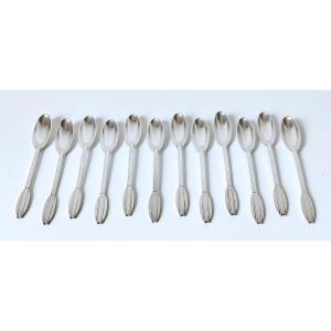 Douze cuillères à thé design en argent massif 