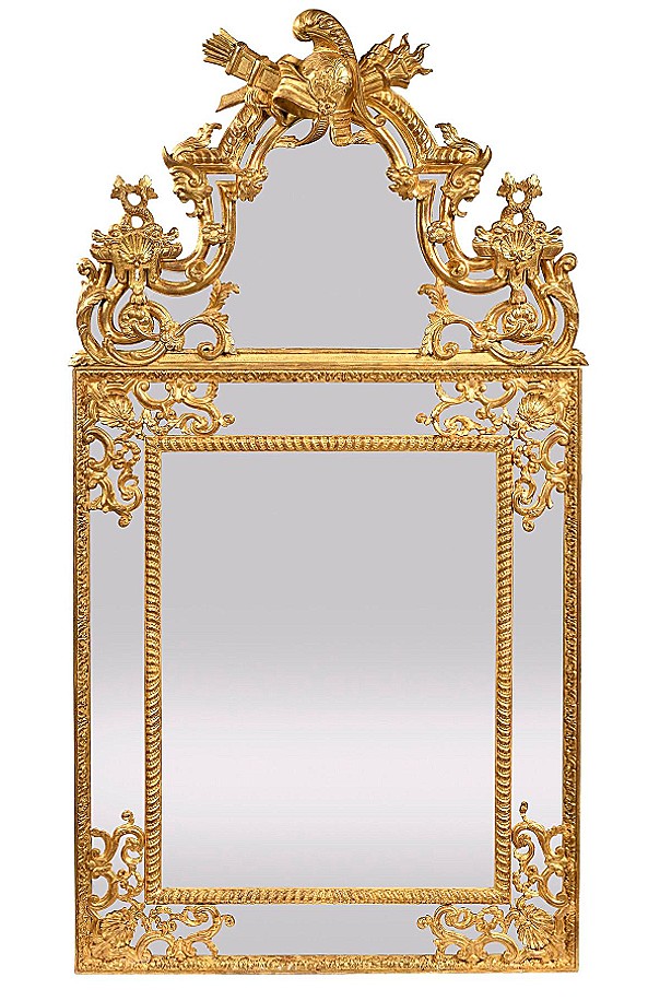 A Decorative Mirror With Soffits And A Pediment