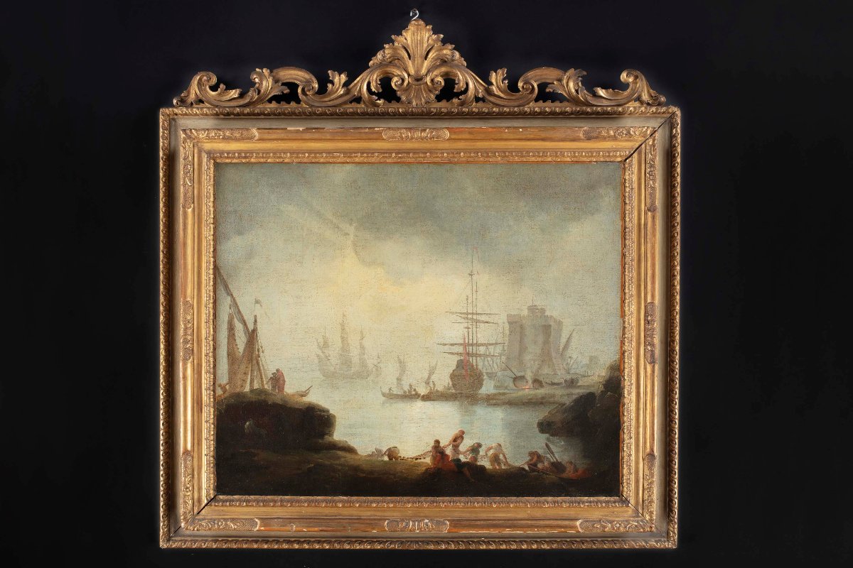 View Of A Harbor With Galleons And Fishermen