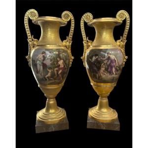 Pair Of Empie Period Amphorae In Gilded Porcelain Painted In Polychrome Neoclassical Scenes