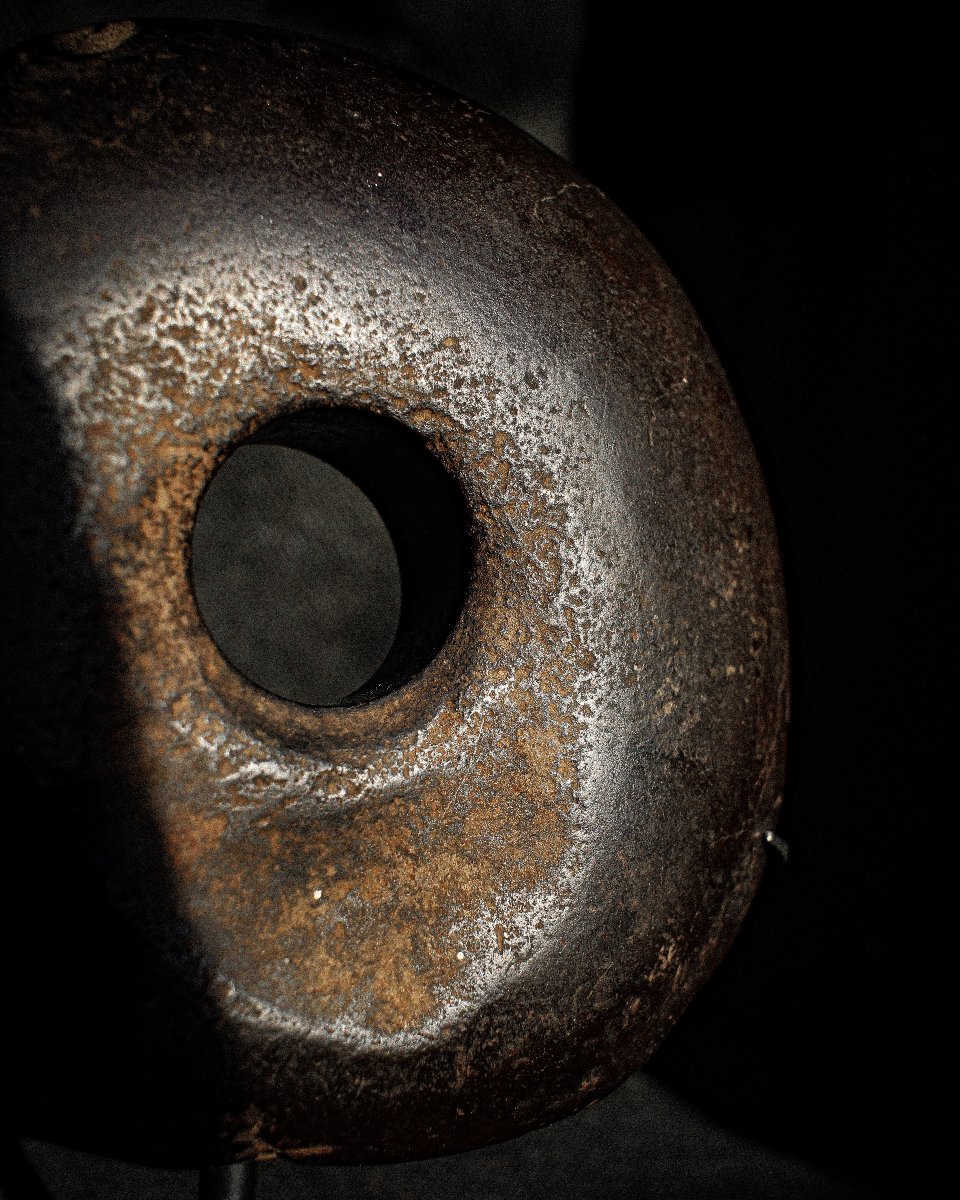 Stone Club Head Or Disc-shaped Club Head On A Base-photo-2