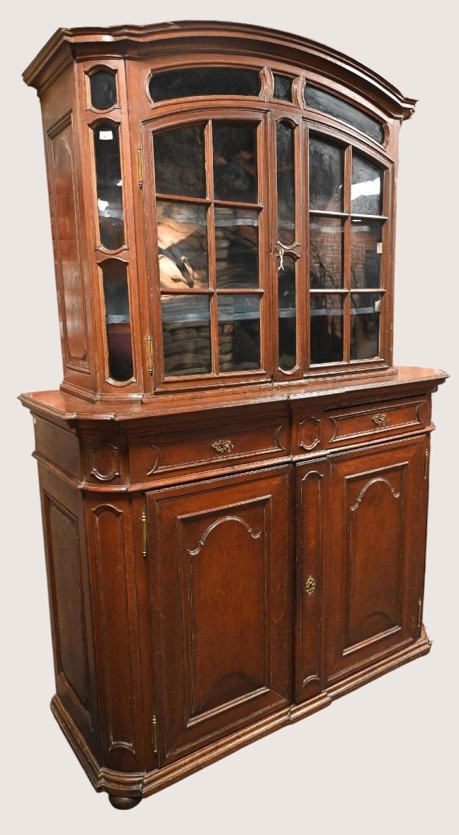 A Two-part Display Cabinet From Liège Made Of Carved Oak.