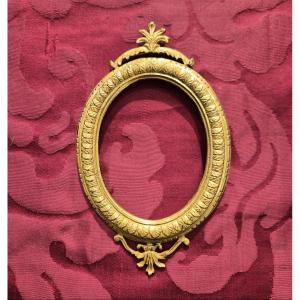 Cadre Louis XVI en bronze doré