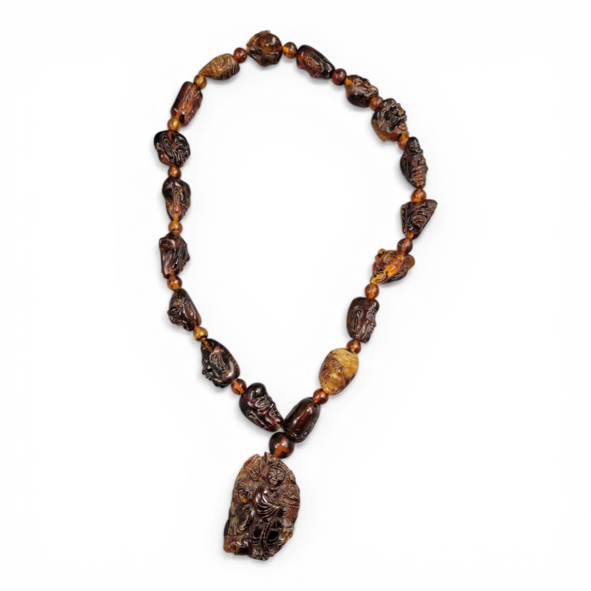 Chinese Amber Necklace With Carved Luohan Heads And Figural Pendant, C. 1870