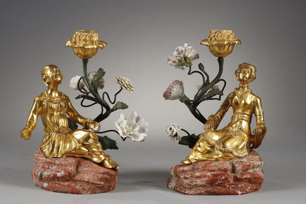 Pair Of So-called “magots” Torches  In Gilded Bronze And Porcelain