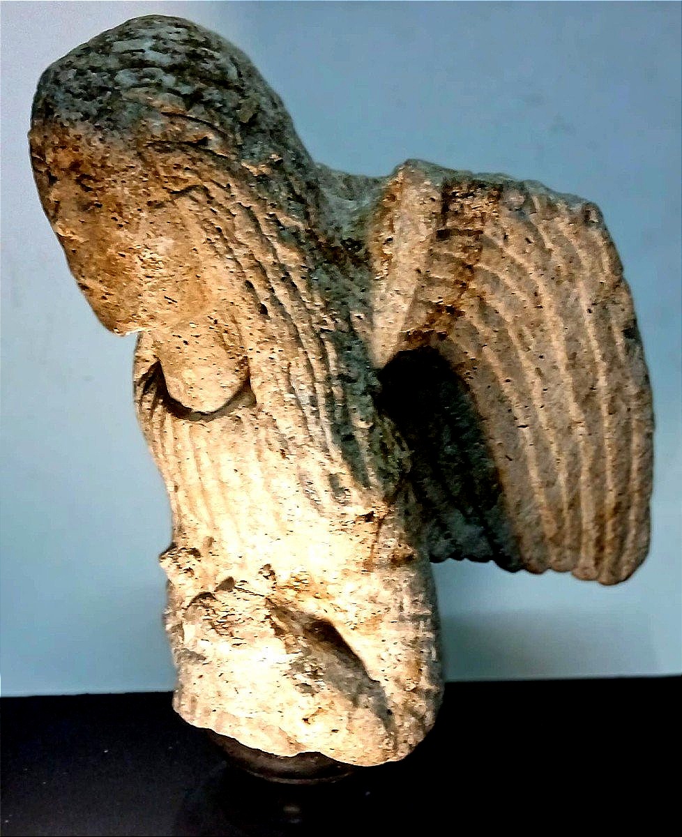 Praying Romanesque Angel, Carved In Stone. A Sculpture Dating From Between The 10th And 12th Centuries.
