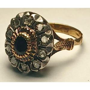 Gold Flower-shaped Ring Set With An Australian Sapphire Surrounded By Diamonds. 1960/70