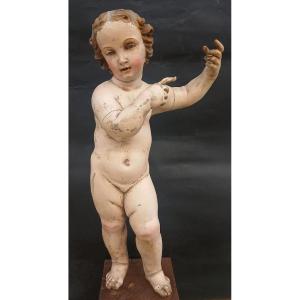 Enfant napolitain en bois sculpté et laqué, datant du XVIIe au début du XVIIIe siècle. cm.54