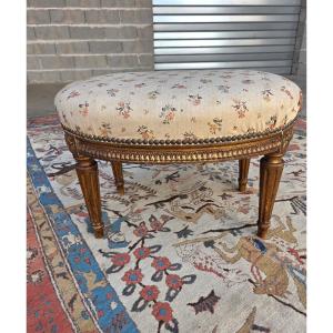 Tabouret en bois mouluré et anciennement doré, Louis XVI, d'époque XIXème