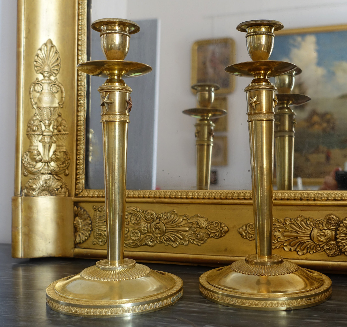 Claude Galle - paire de flambeaux bougeoirs aux étoiles d'époque Empire, bronze doré au mercure